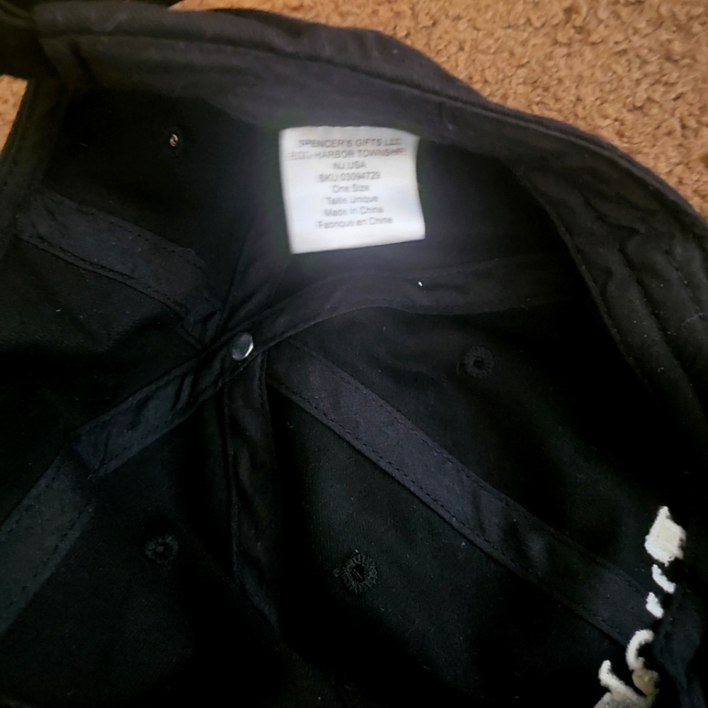 F**k. Hat. Black and white writing.